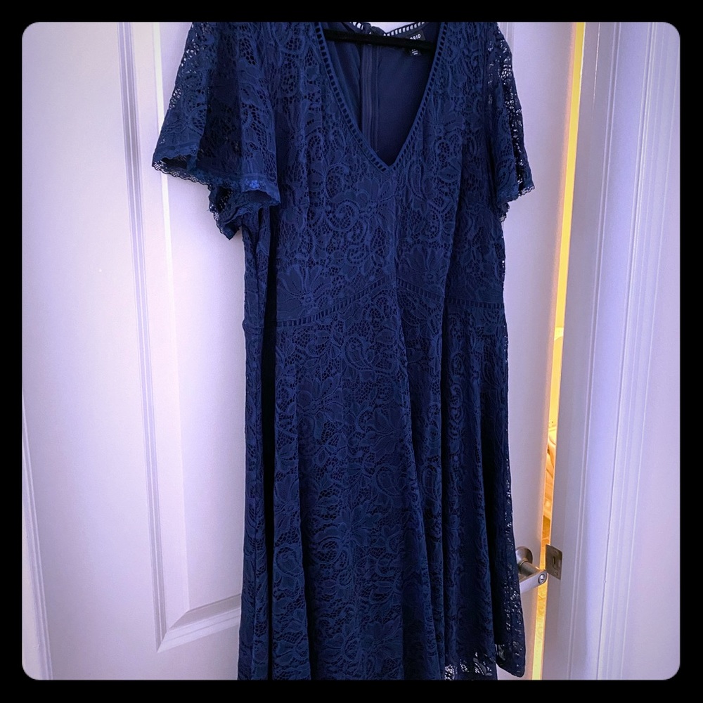 Beautiful navy dress with overlay, lined. NWOT.